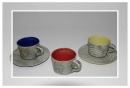 Teacups and saucers in various colours